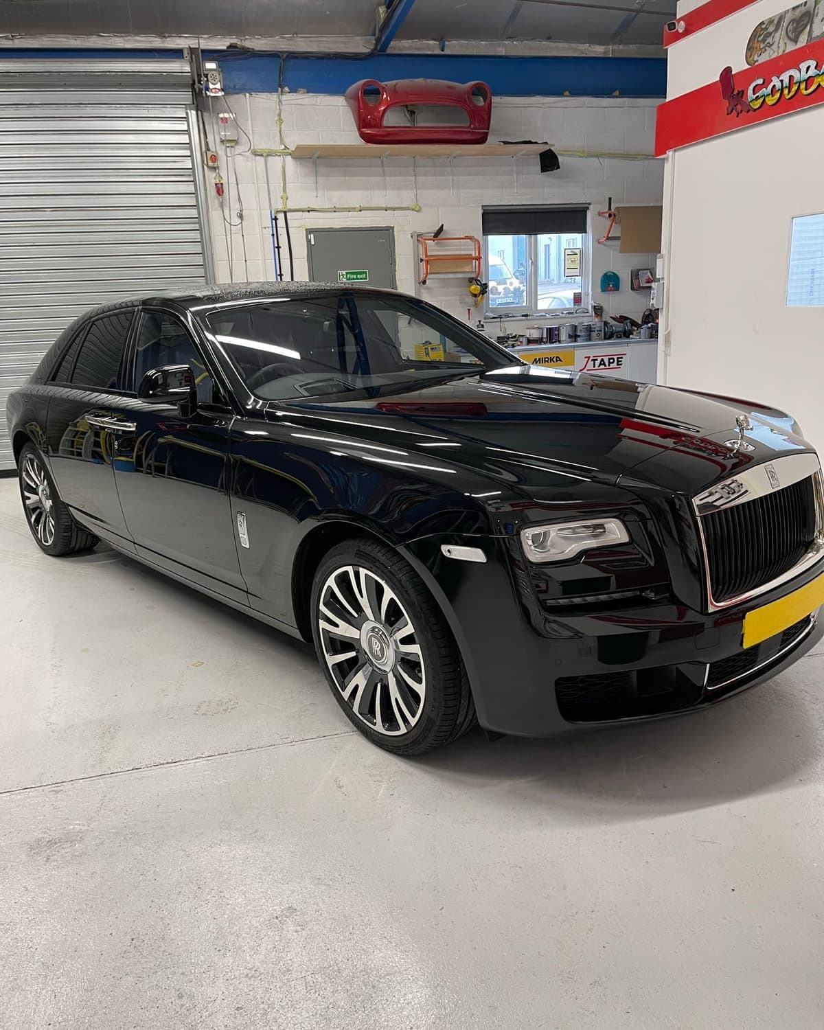 Black Rolls-Royce polished to a straight, undistorted reflection