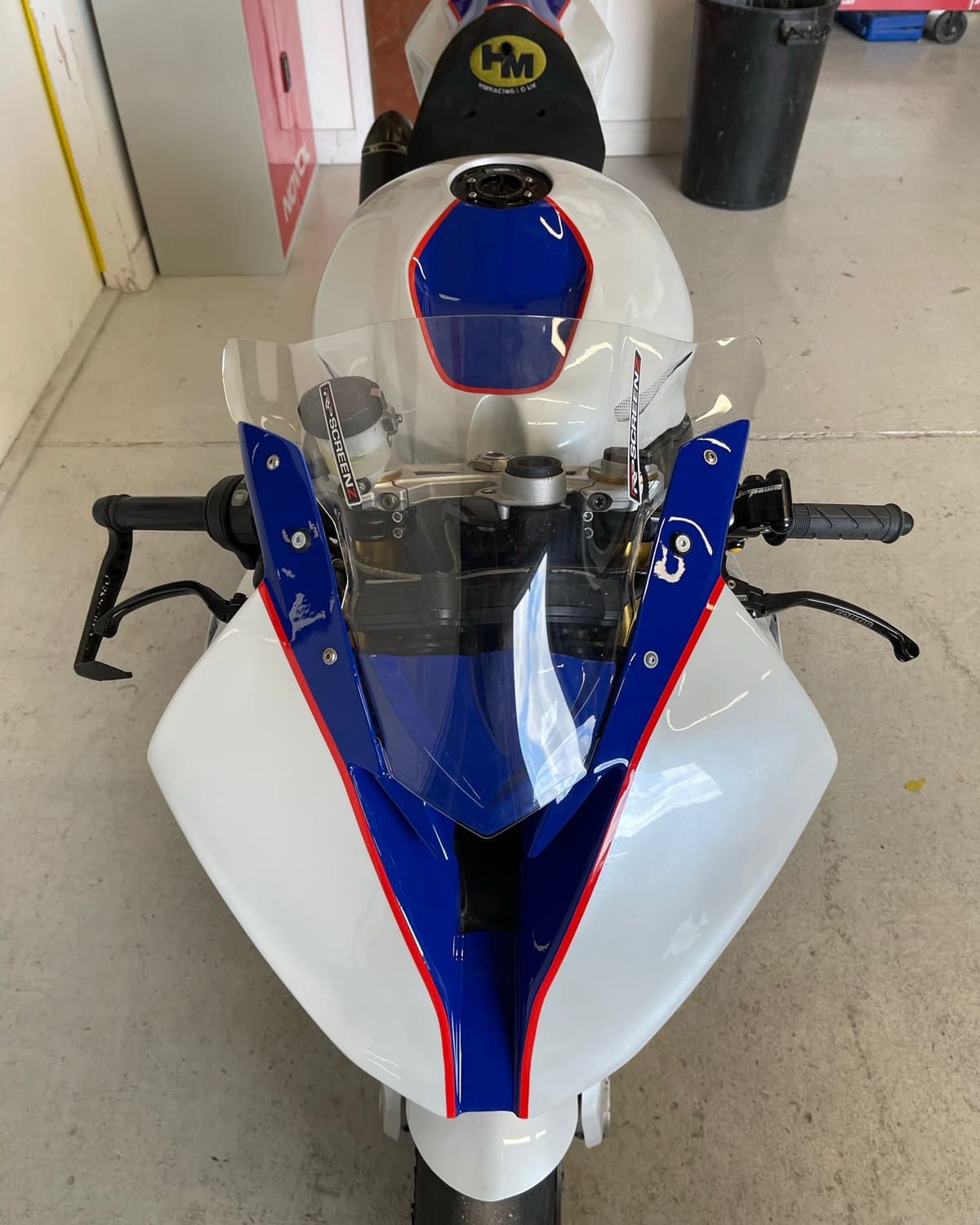 Front fairing and screen of a BMW S1000RR in fresh white, blue and red paint