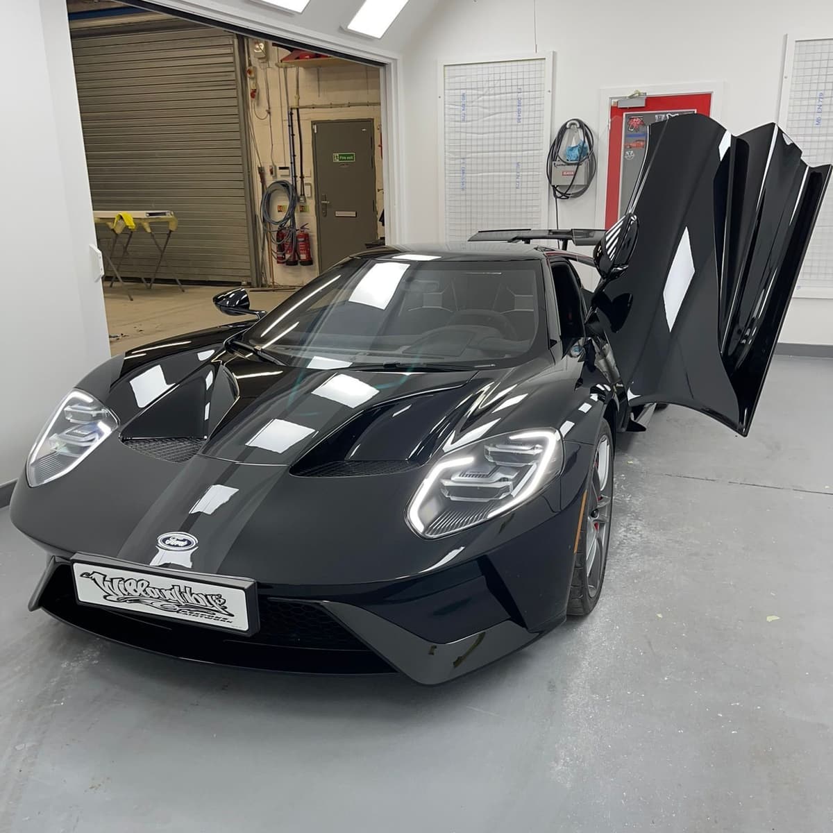 Ford GT with both doors raised, showing the finish across the whole car