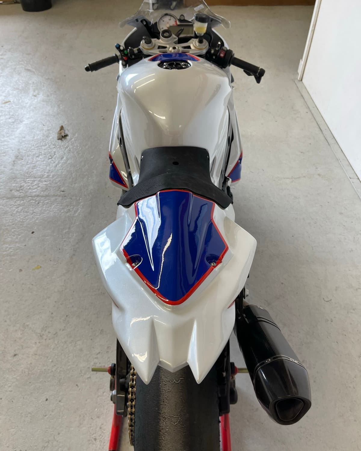 Front of a BMW S1000RR showing the fresh white, blue and red paintwork on the tank and fairing